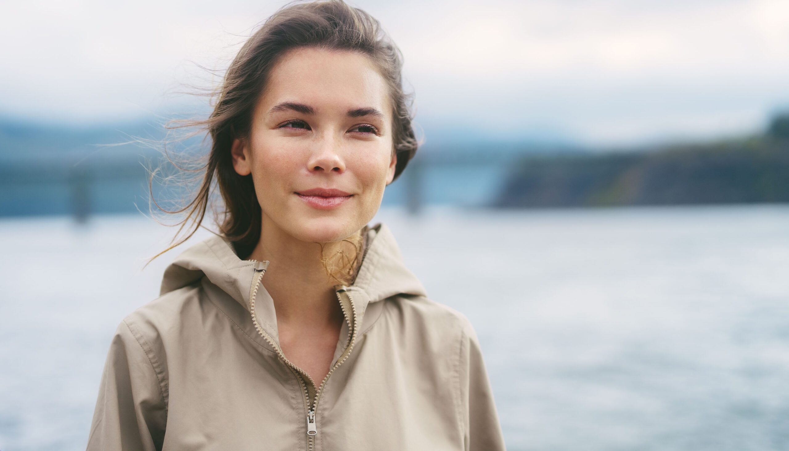 Portrait of a woman outdoors, illustrating an article about BodyTite and FaceTite skin tightening